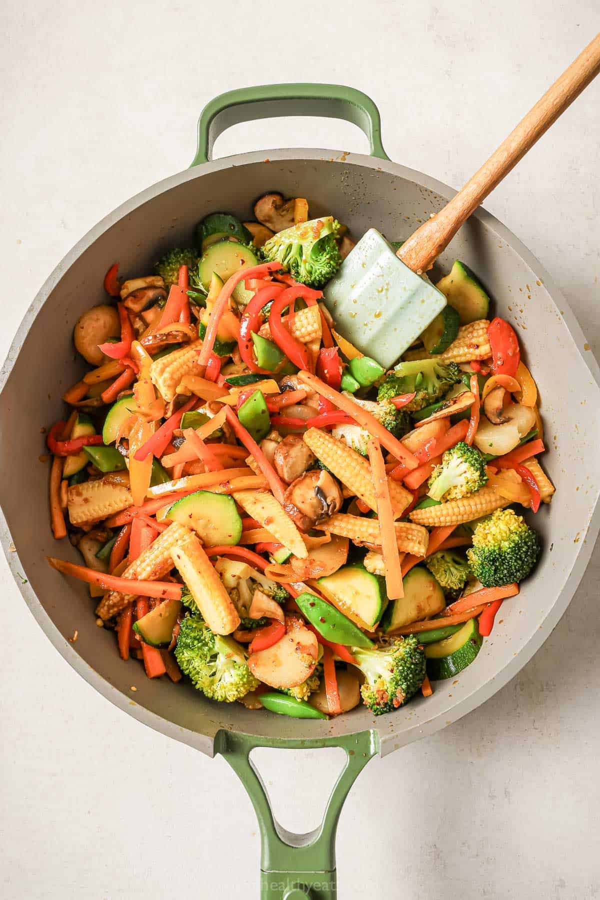 Stirring stir fry in skillet