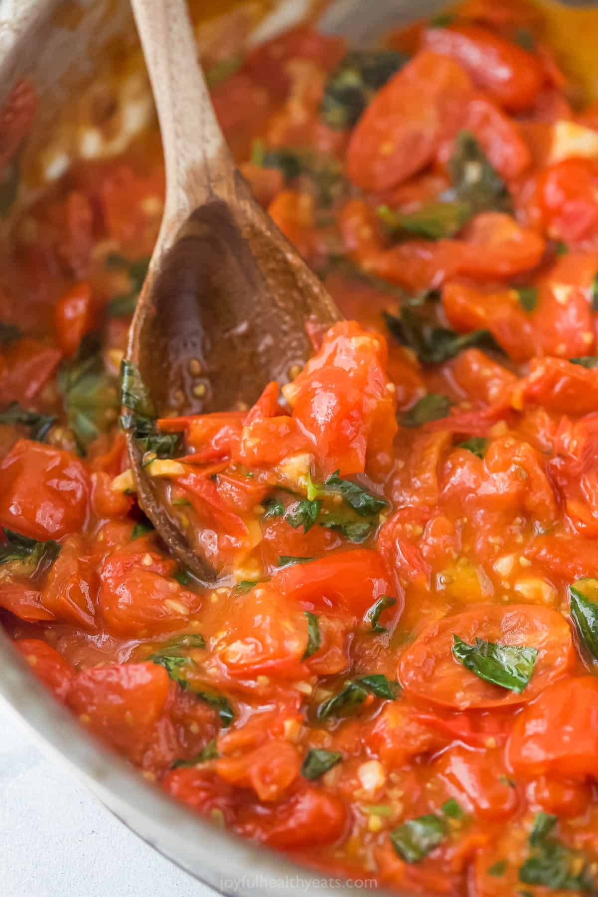Spoon scooping homemade pasta sauce