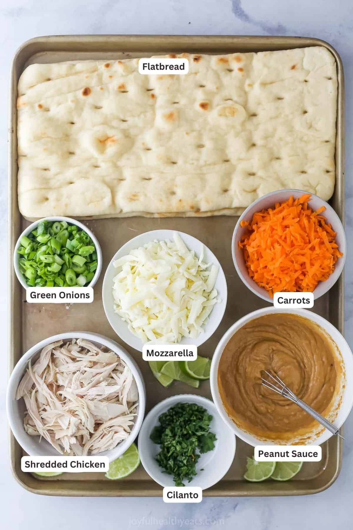 Labeled ingredients for the Thai chicken pizza. 