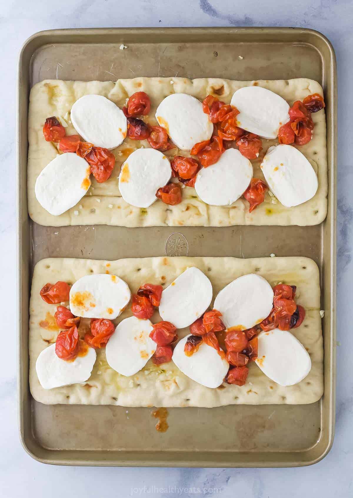 Assembling the toppings on the flatbread. 