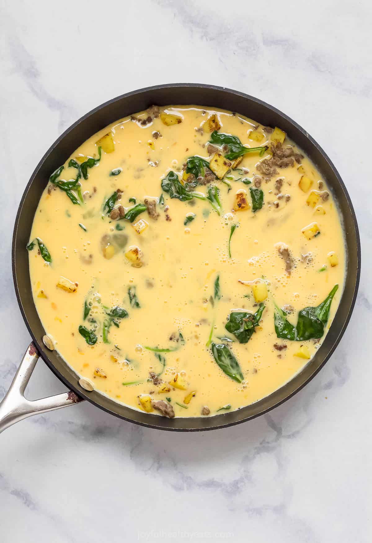 Frittata mixture in the pan before baking. 