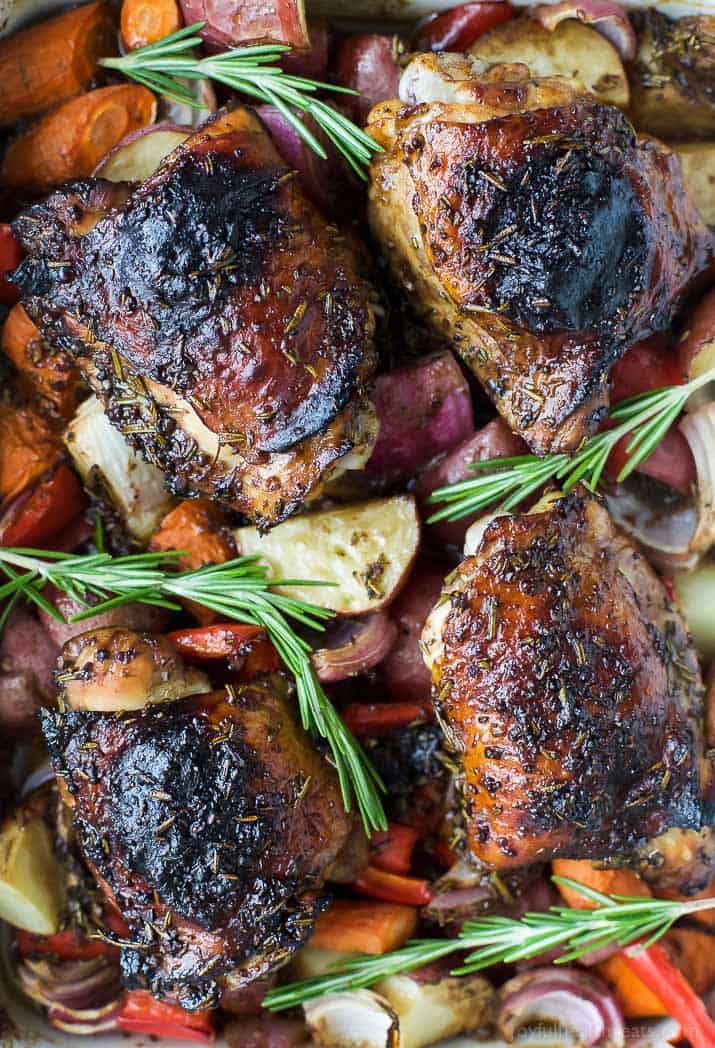 Close-up of juicy roasted chicken thighs with balsamic marinade and crispy skin. 