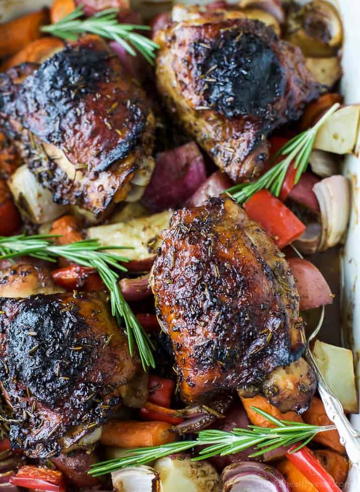 Crispy-skinned roasted balsamic chicken with garlic, potatoes, carrots, peppers, and onions.