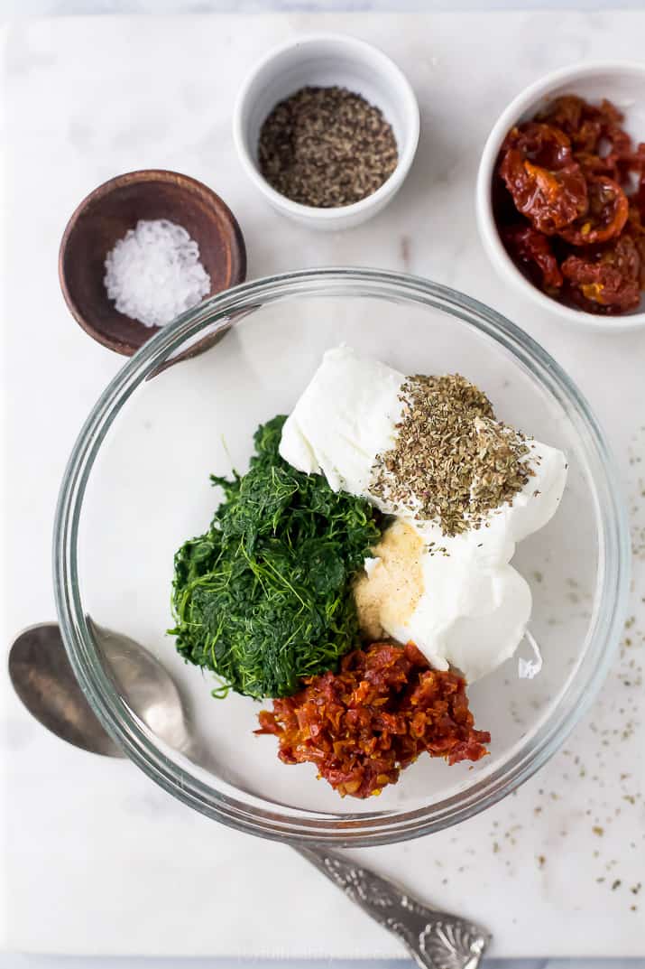 bowl filled with spinach and goat cheese filling