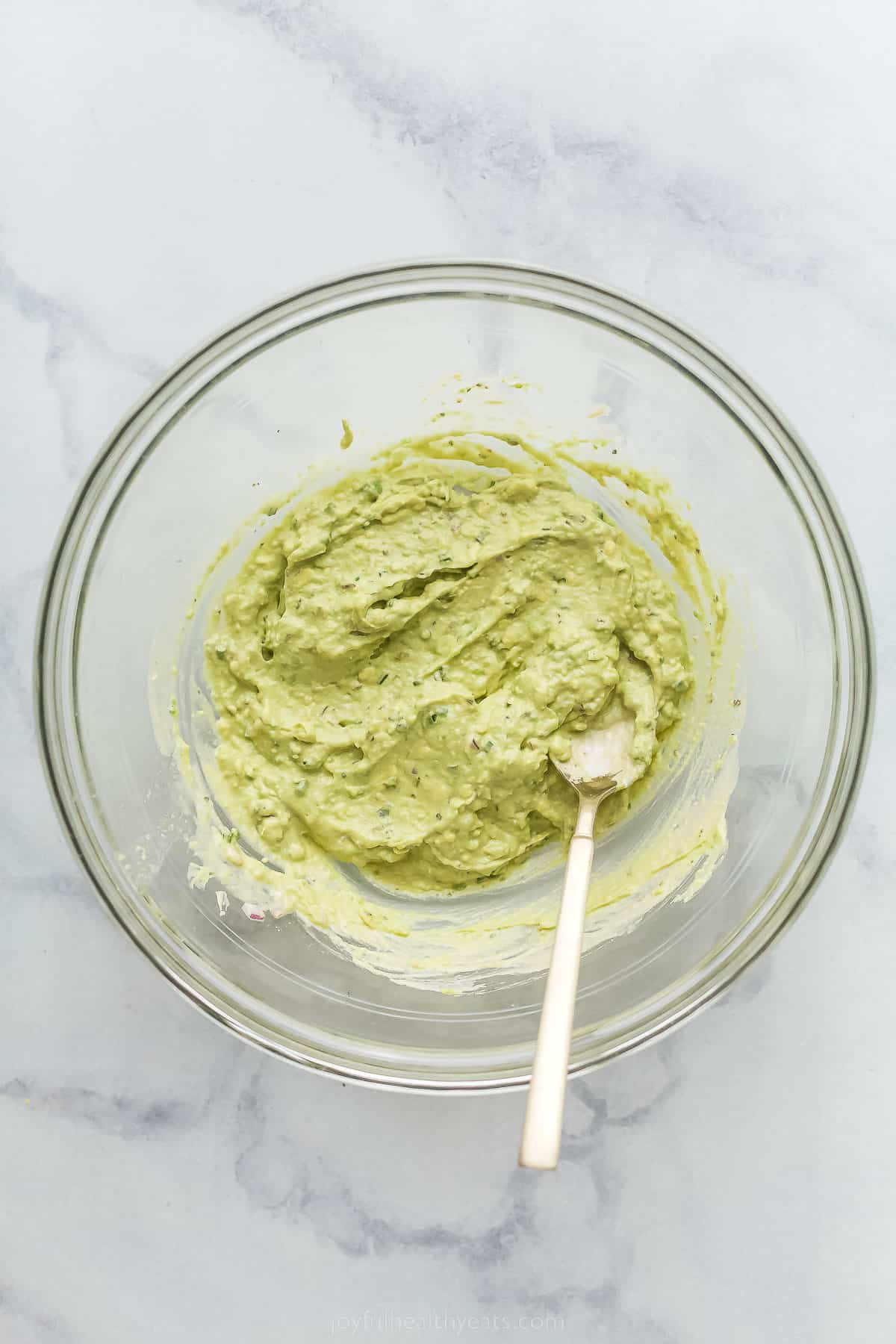 pureed avocado in a large glass bowl