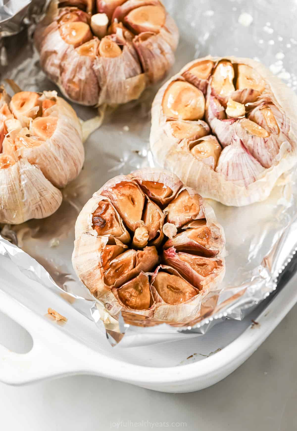 Roasted garlic in foil-lined pan