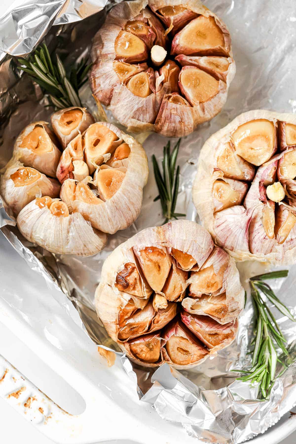 Roasted garlic bulbs on foil