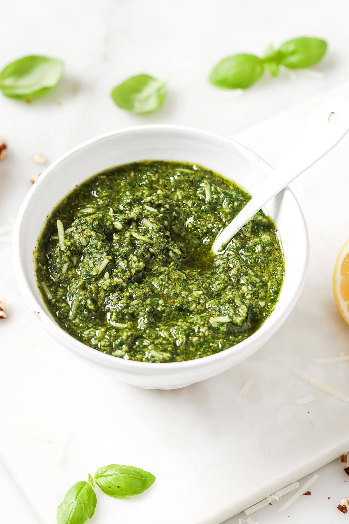 Bowl of homemade basil pesto with spoon