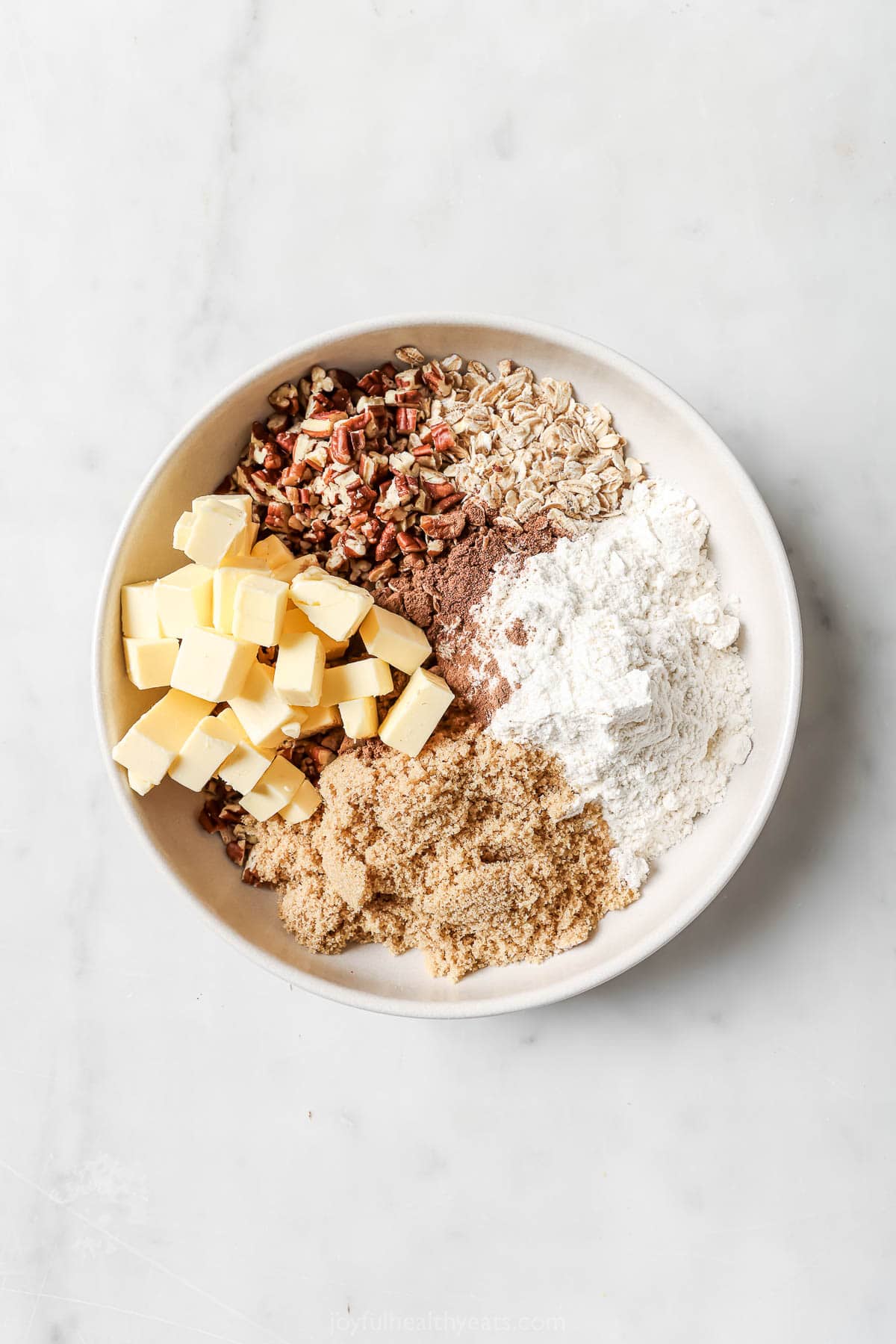 Overhead view of ingredients for crisp topping in bowl