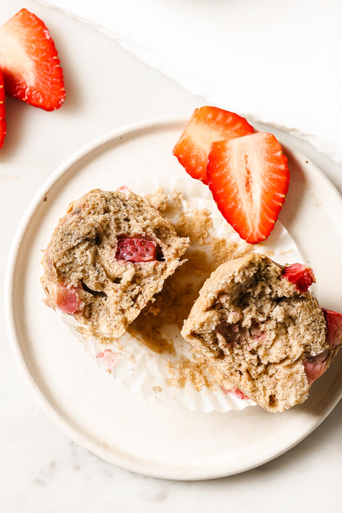 Halved strawberry banana muffins. 