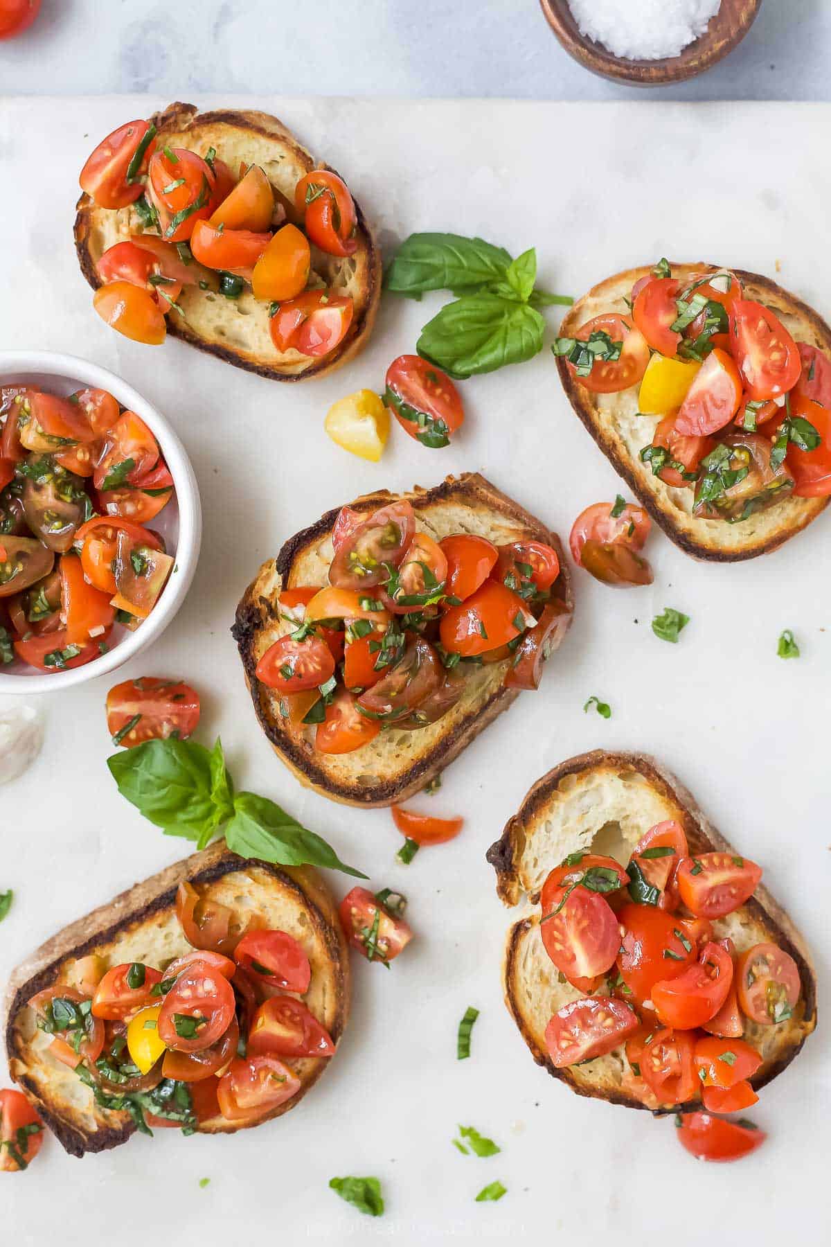 Overhead view of tomato bruschetta with balsamic reduction