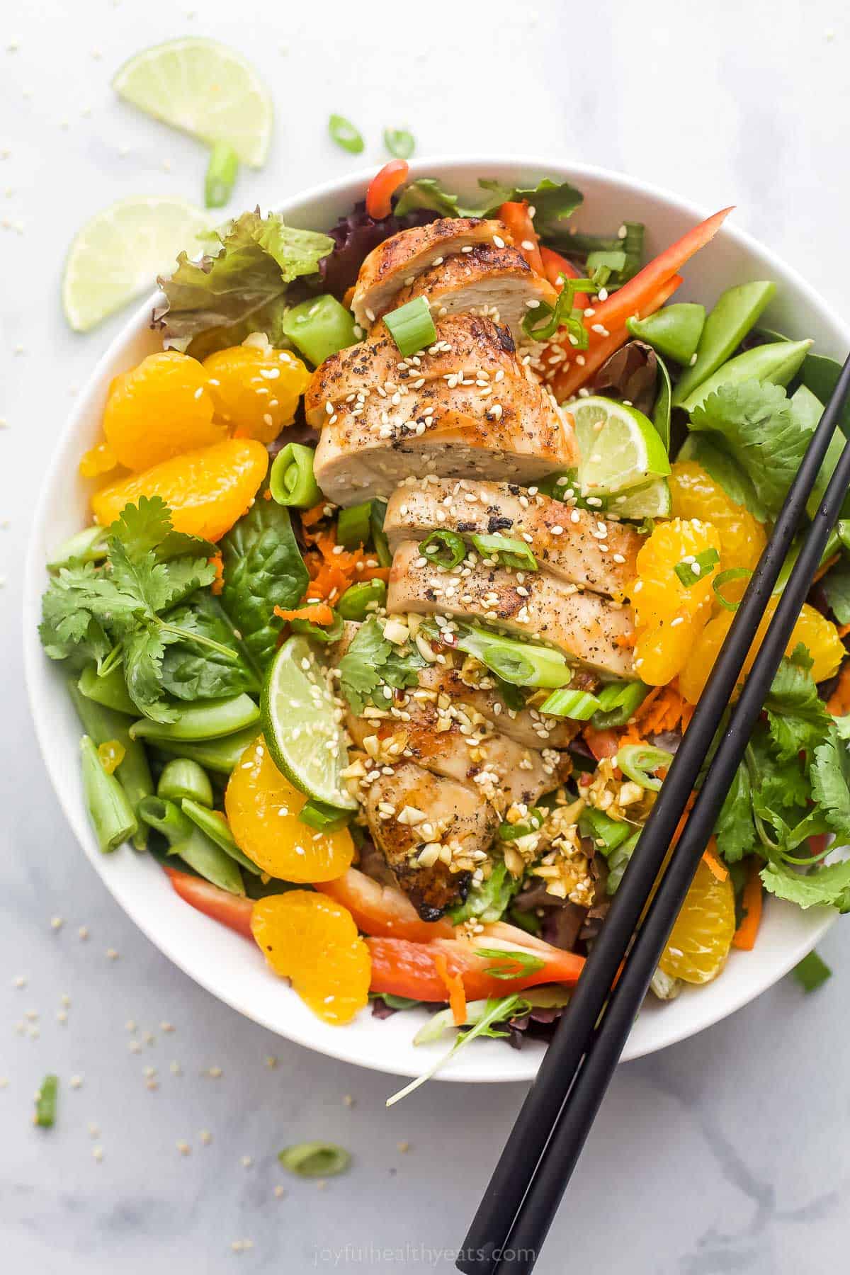 This Asian chicken salad with sesame ginger dressing is the salad you want to make when you're craving fresh vegetables, a hint of sweetness, and a bright and tangy dressing! Chinese chicken salad with sesame ginger dressing and mandarin oranges.
