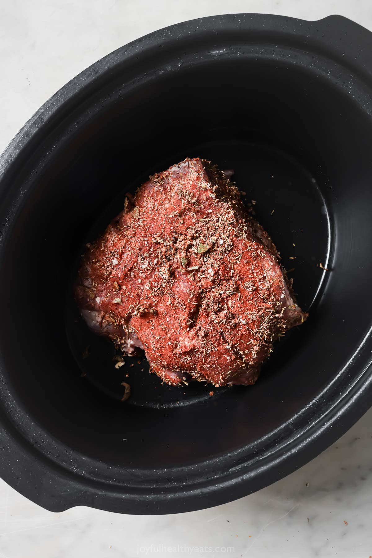 Spice-rubbed pork shoulder in the crockpot. 