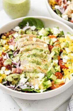 Chicken Cobb salad in bowl with creamy poblabo dressing