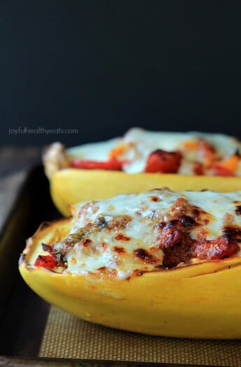 An easy healthy spanish inspired weeknight dinner, Chorizo Kale & Pepper Stuffed Spaghetti Squash Boats! | purewellnessjourneyclub.com