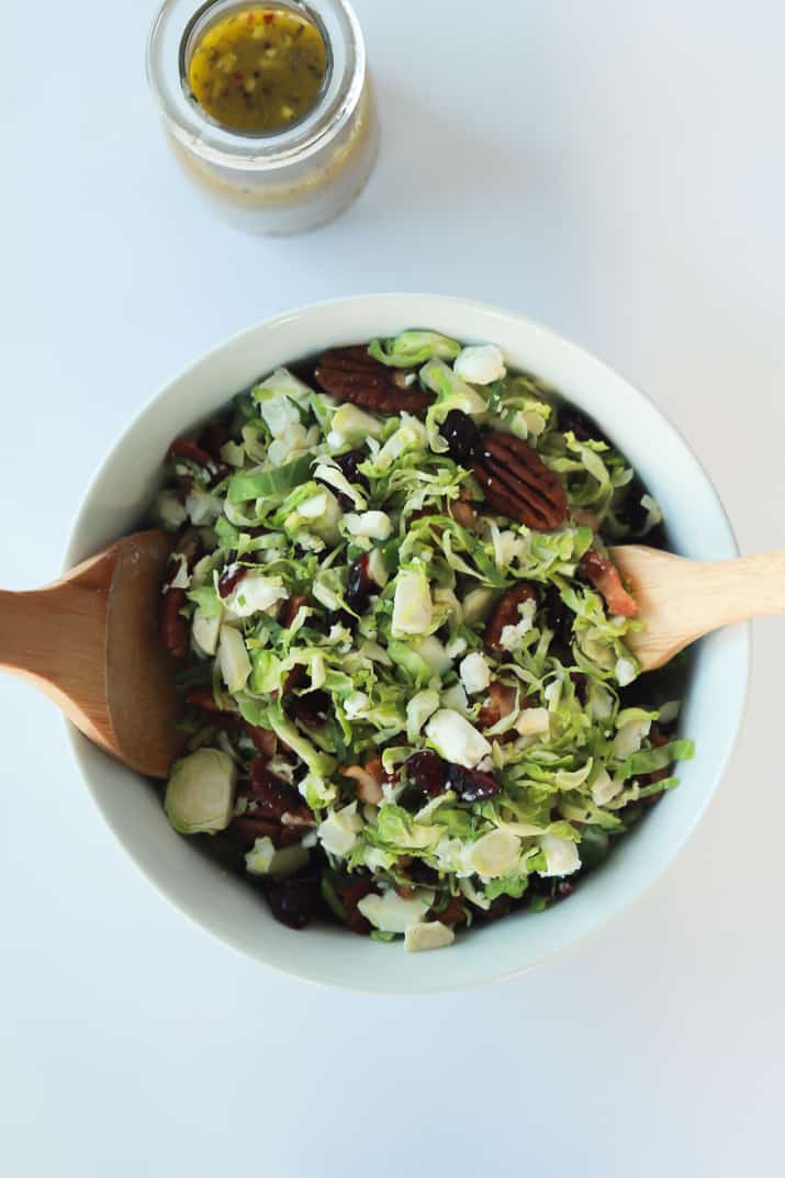 You need this Salad in your life & on the table! Shaved Brussels Sprouts Harvest Salad with Hard Apple Cider Vinaigrette | purewellnessjourneyclub.com #thanksgiving #healthy 