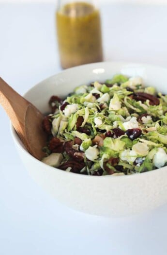 You need this Salad in your life & on the table! Shaved Brussels Sprouts Harvest Salad with Hard Apple Cider Vinaigrette | purewellnessjourneyclub.com #thanksgiving #healthy