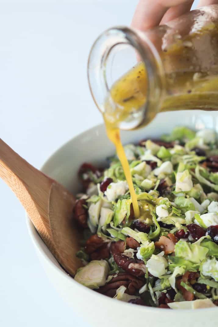 You need this Salad in your life & on the table! Shaved Brussels Sprouts Harvest Salad with Hard Apple Cider Vinaigrette | purewellnessjourneyclub.com #thanksgiving #healthy 