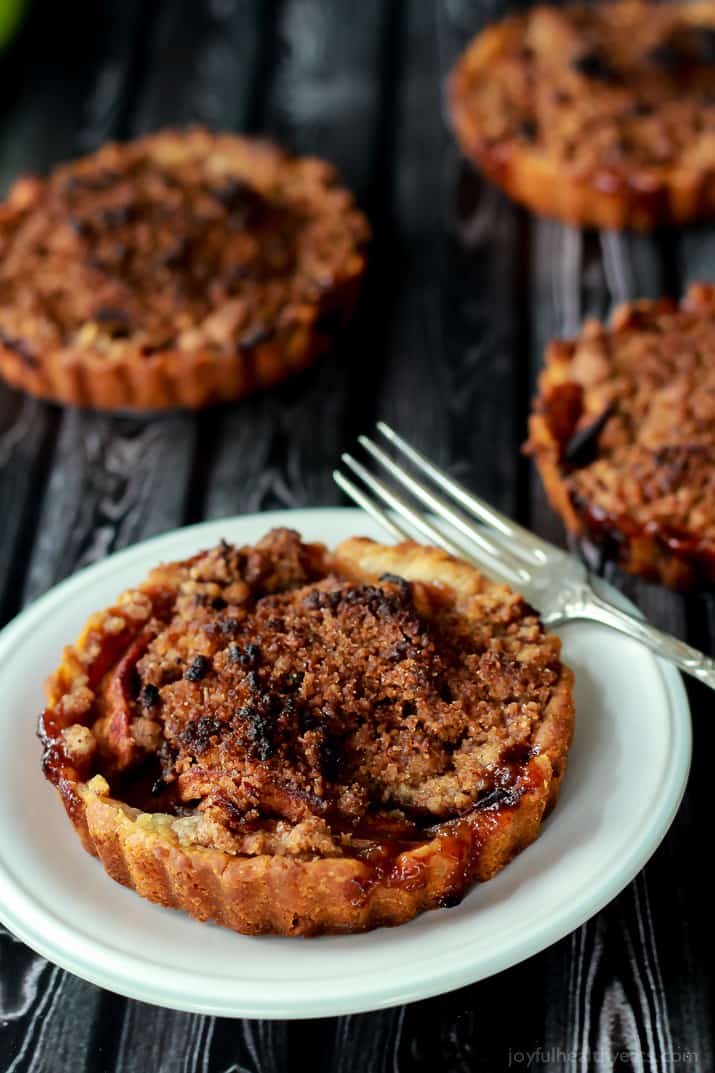 Built in portion control makes these Mini Apple Pie Tartlets with Pecan Streusel extra irresistible! The ultimate fall dessert! | purewellnessjourneyclub.com Built in portion control makes these Mini Apple Pie Tartlets with Pecan Streusel extra irresistible! The ultimate fall dessert! | purewellnessjourneyclub.com 