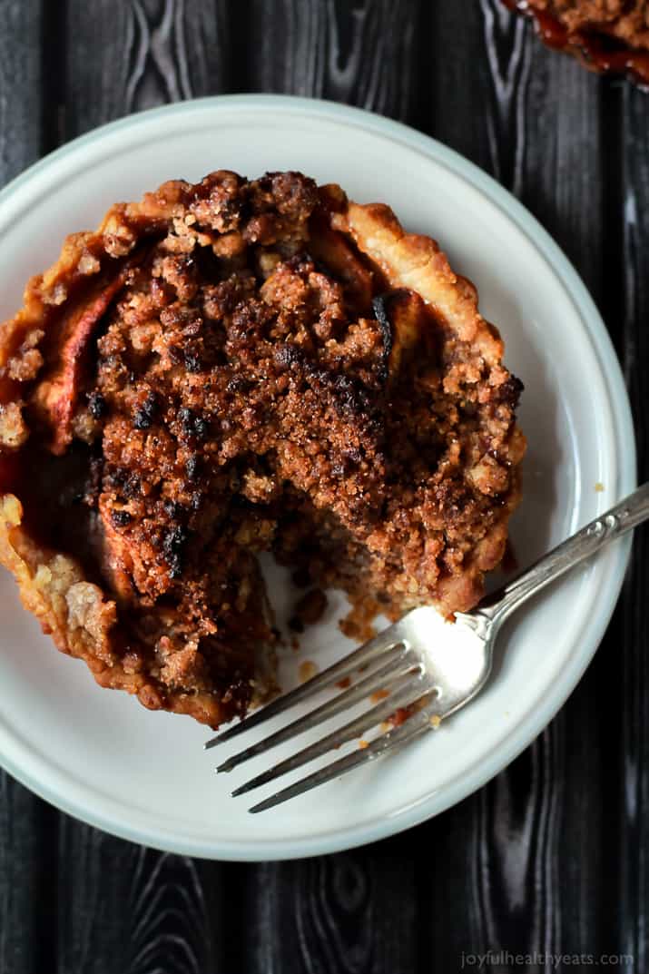 Built in portion control makes these Mini Apple Pie Tartlets with Pecan Streusel extra irresistible! The ultimate fall dessert! | purewellnessjourneyclub.com 