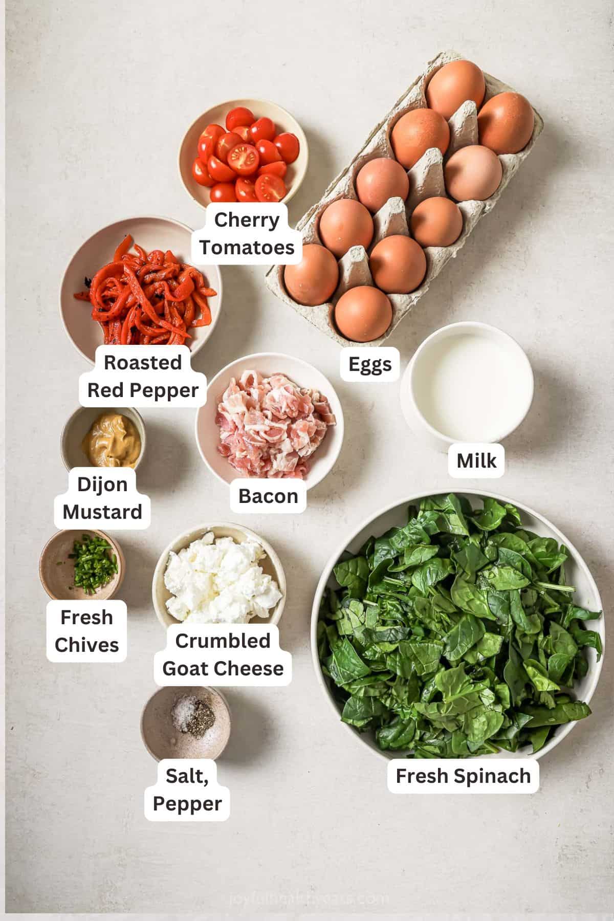 Overhead view of ingredients for cheesy bacon spinach frittata