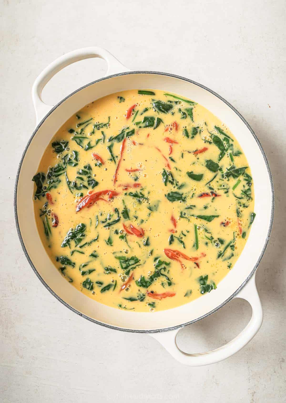 Egg added to pan for frittata