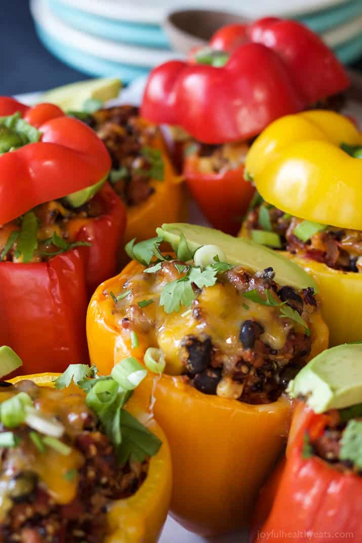 Southwestern Turkey Quinoa Stuffed Peppers filled with loads of protein and bold flavors that will leave you feeling satisfied and hungry for more all at the same time! Only 262 calories a serving! | joyfulhealthyeats.com #recipes