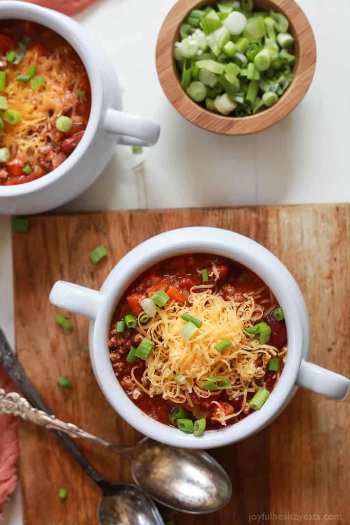 Made with tender beans, juicy ground turkey, and an assortment of veggies, this crockpot turkey chili recipe is so hearty and filling! Overhead view of a bowl of turkey chili.