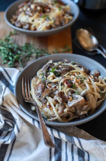 Drunken Wild Mushroom Pasta with a Creamy Goat Cheese Sauce - this recipe is total comfort food! Easy, done in just 30 minutes, only 331 calories, and vegetarian | joyfulhealthyeats.com