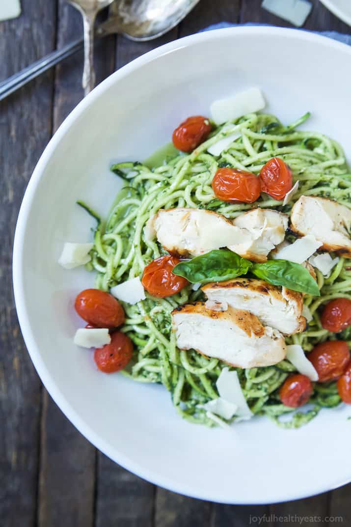 An easy dinner recipe for a busy week, and no stove needed! Pesto Chicken Zoodles with Burst Tomatoes, full of bold flavors, high in protein, and in low carbs! Your family will love it! | joyfulhealthyeats.com