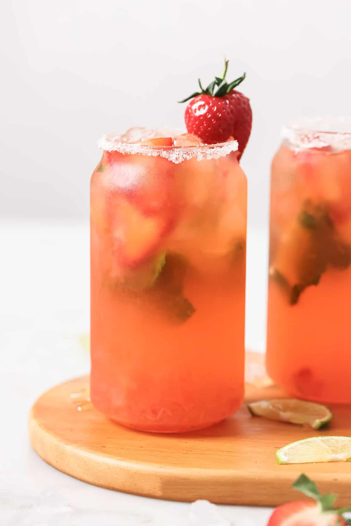 This agave-sweetened strawberry mojito recipe with fresh mint and tangy lime juice is an easy 5-minute summer cocktail. An agave-sweetened strawberry mojito recipe with a salt rim.