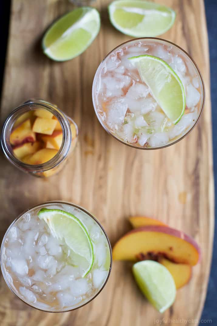 Brazilians know how to make a cocktail! Perfectly refreshing and easy to make - this Peach Caipirinha is hands my drink of choice! | joyfulhealthyeats.com