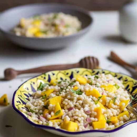 An Easy Mango Couscous Salad packed with sweet mango and a light dressing. This salad is a quick 15 minute side dish you're family will love, perfect with seafood or chicken. | joyfulhealthyeats.com