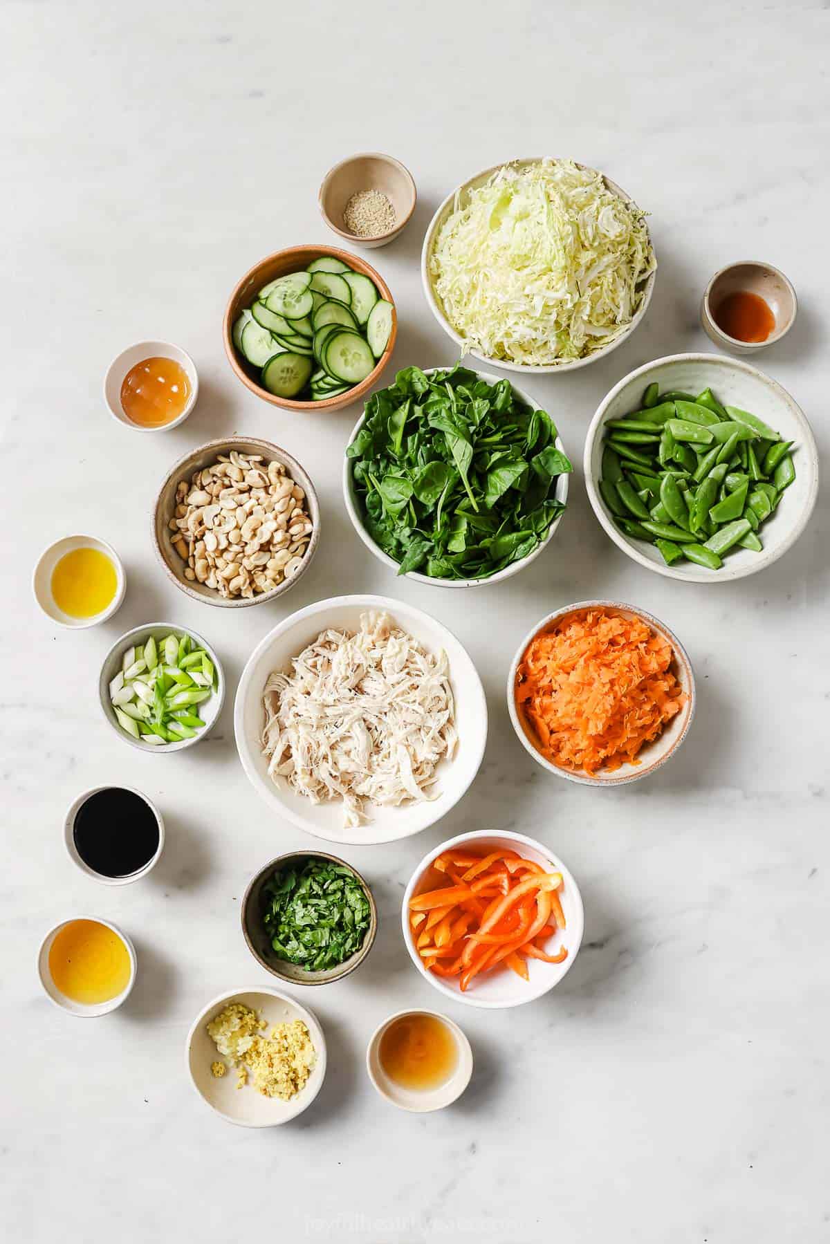 This mason jar salads recipe is the perfect work-lunch idea. It's loaded with veggies, rotisserie chicken, and a homemade sesame dressing. Ingredients for mason jar salads.