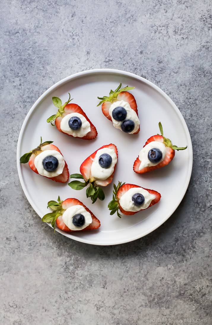 Patriotic Cheesecake Stuffed Strawberries - an easy healthy recipe that tastes like strawberry cheesecake but without all the calories!