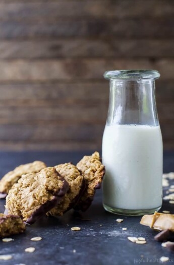 Soft & Chewy Healthy Oatmeal Peanut Butter Cookies dunked in Dark Chocolate - the perfect cookie recipe this holiday season. It's sure to be Santa's favorite!