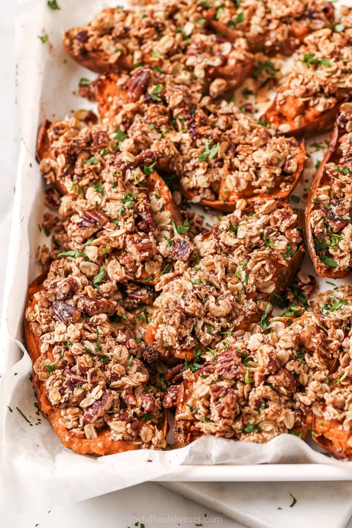 This twice baked sweet potatoes recipe with crunchy oat-pecan streusel, maple syrup, and cinnamon is the perfect Thanksgiving side. Twice baked sweet potatoes with smokey oat streusel on top.