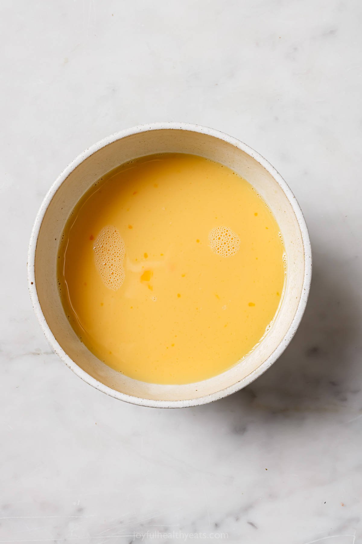 Whisked eggs in a bowl. 