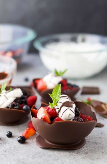 DIY Chocolate Bowls made with balloons that are filled with fresh berries and topped with a dairy free Coconut Whipped Cream. These Chocolate Bowls are the perfect light and refreshing Valentines Day dessert.