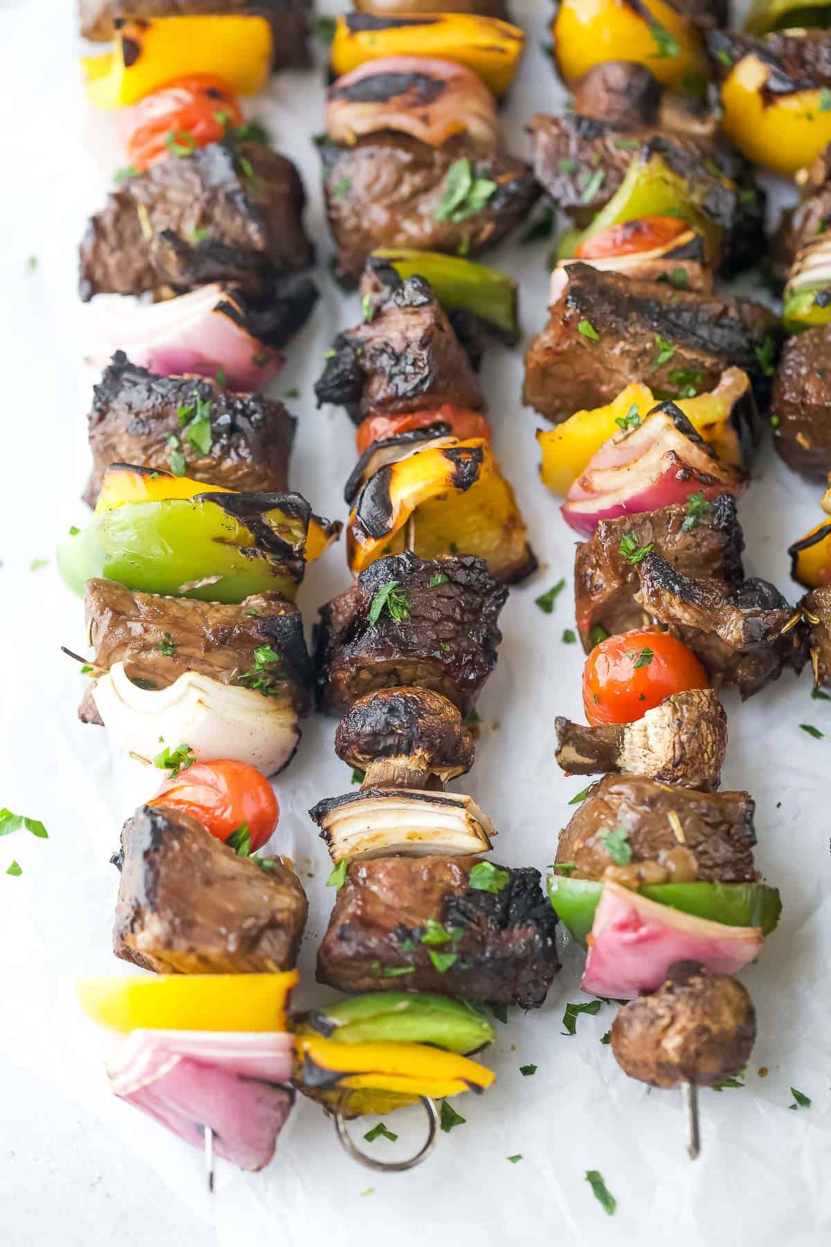 This juicy, grilled kabobs recipe with sweet-and-savory balsamic marinade and fresh, crunchy veggies is an easy summer lunch. Perfectly charred, juicy beef kabobs with bell peppers, onions, tomatoes, and mushrooms.