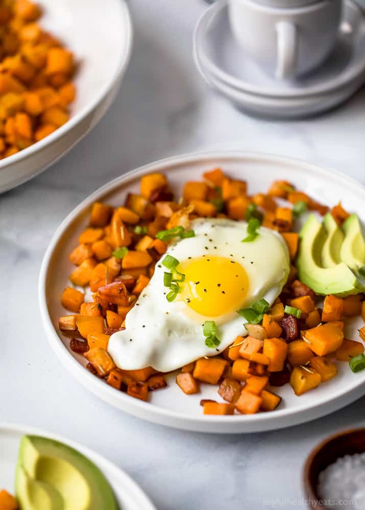 Sweet potato hash with a sunny-side up egg and creamy avocado.