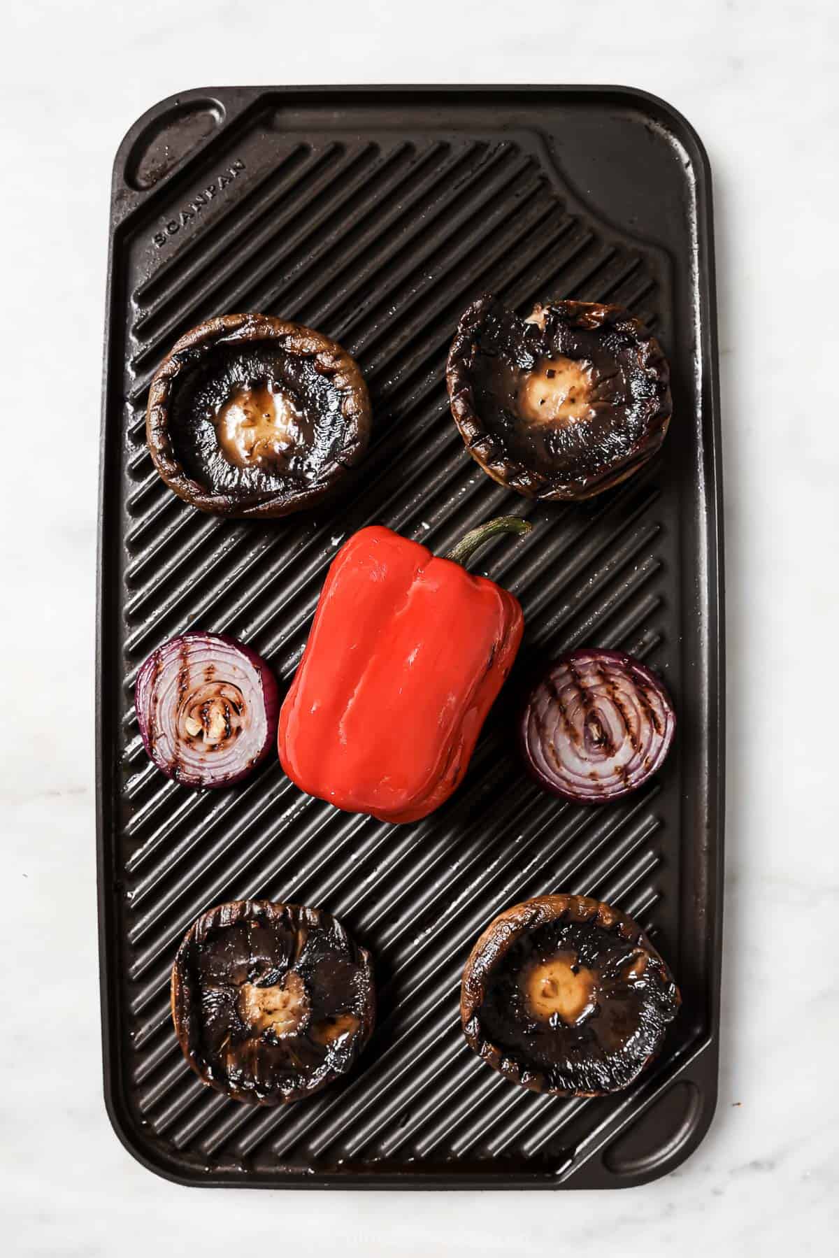 Portobellos, onions, and red pepper on the grill. 