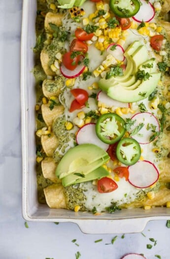 These Chicken Enchiladas smothered in a Poblano Cream Sauce will quickly become a family favorite. If you're looking for a flavorful recipe these Chicken Enchiladas are it - they're the ultimate healthy Taco Tuesday meal!