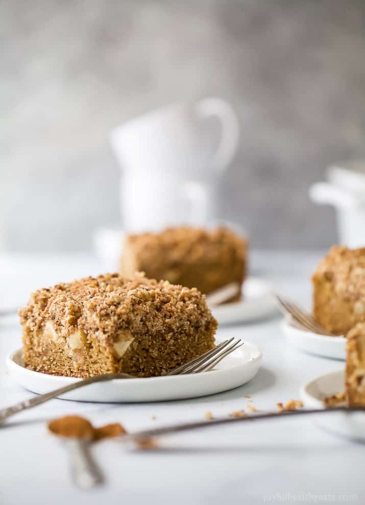 A slice of apple cinnamon coffee cake with chunks of Granny Smith apple.