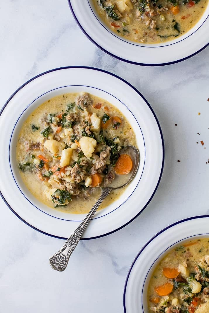 Three bowls of comforting zuppa toscana. 