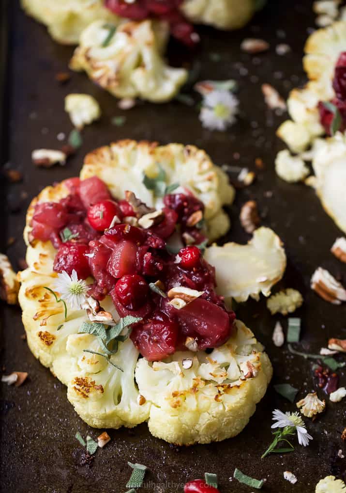 Close-up of the roasted cauliflower steak recipe with homemade apple-cranberry chutney on top. 
