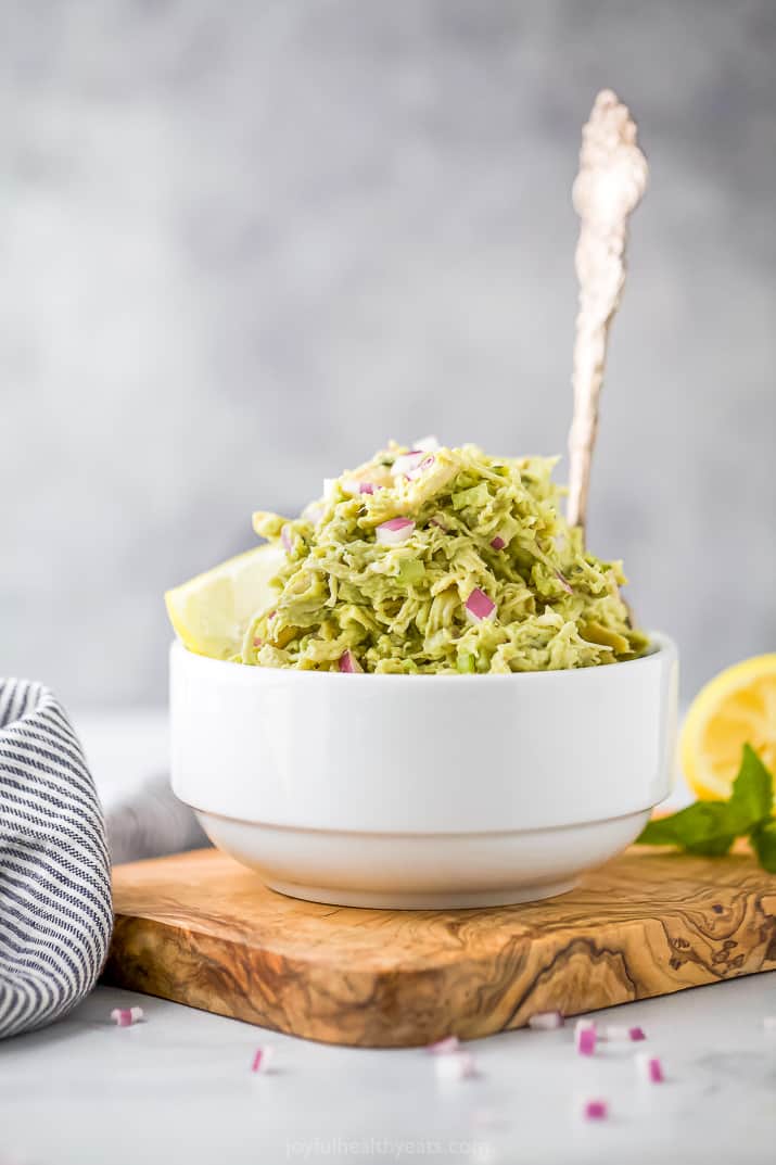 This Avocado Chicken Salad is a creamy & healthy chicken salad recipe that's mayo free. Packed with flavor and perfect for meal prep! avocado chicken salad in a bowl