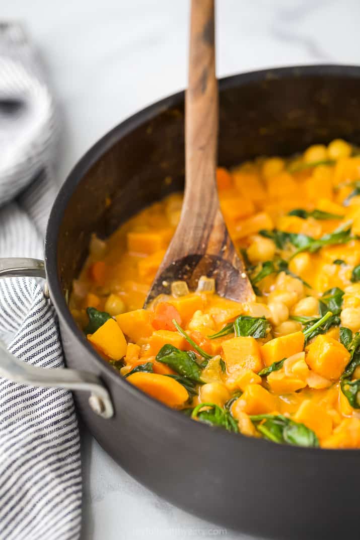 side photo of vegan sweet potato chickpea curry in a pot