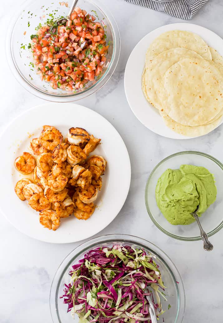 all the ingredients to make spicy shrimp tacos