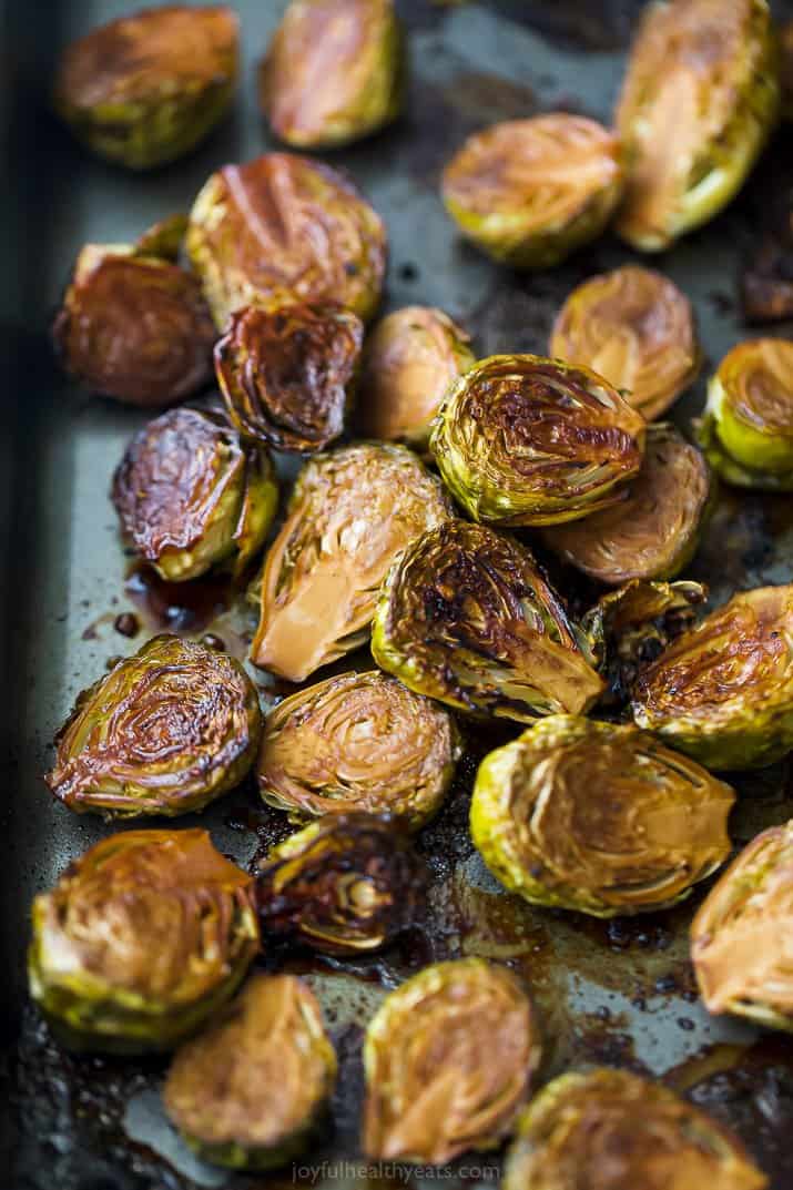 a baking sheet filled with balsamic roasted brussel sprouts